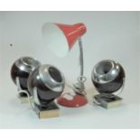 A set of three 1970s chrome wall mounted spotlights of spherical form together with an orange