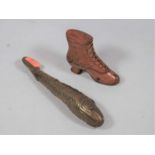 A 19th century carved boxwood snuff box in the form of a lady's boot, h.6.5cm; together with a brass