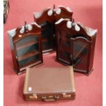 Three reproduction faux mahogany hanging collectors' wall cabinets, together with a combination