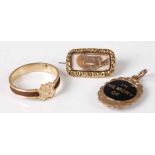 A Victorian gilt metal and braided mourning ring, size N, together with yellow metal mourning brooch