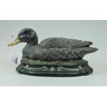 A modern cast iron door stop in the form of a duck