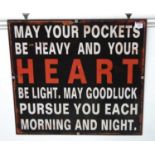 A reproduction enamel sign bearing Good Luck verse