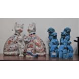 A pair of large turquoise glazed Chinese fo dog figures each in seated pose on rectangular plinth,