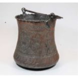 A late 19th century Persian copper bucket, of waisted cylindrical form, the body relief decorated