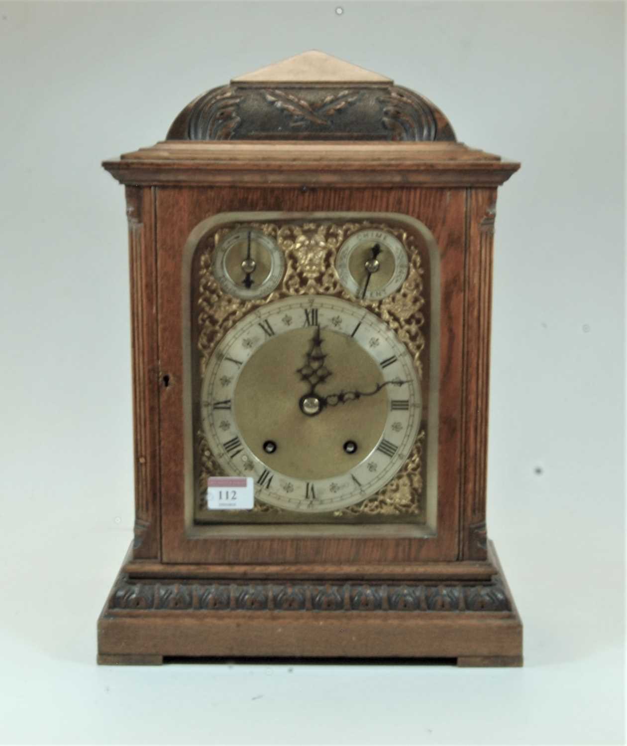 A late 19th century Winterhalder & Hofmeier oak cased bracket clock, having an arched brass dial