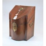 A George III mahogany knife box, of serpentine form, having later fitted interior and brass handles,