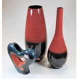 A John Rocha ceramic vase, of ovoid form, glazed in red and black, h.43cm; together with one other