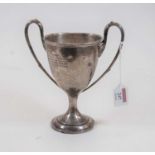 An Edwardian silver twin handled pedestal trophy cup, 10.6oz, Birmingham 1910, height 20cm (a/f)