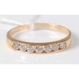 An 18ct gold diamond half eternity ring, the seven channel set brilliants weighing 0.5ct, 2.6g, size