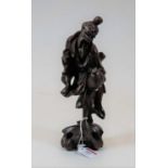 A Chinese softwood carving of a peasant figure, height 25cm