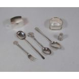 A small collection of miscellaneous silver, to include napkin rings, thimble, spoons etc