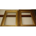 A late Victorian gilt composition picture frame, rebate dimensions 75 x 50cm; together with one