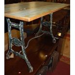 A distress painted beech topped and cast iron based rectangular pub table, w.122cm