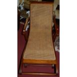 A contemporary hardwood and cane inset plantation chair, width 71cm