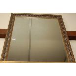 A modern gilt composition framed and bevelled wall mirror, 100 x 71cm