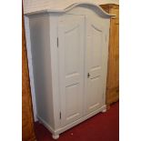 A contemporary French style painted pine double door armoire, having twin recessed doors and