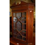 A circa 1900 mahogany, satinwood strung and inlaid astragal glazed single door hanging corner