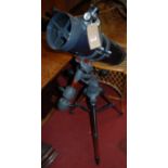 A Celestron Astromaster 130 telescope, raised on integral standCondition report: Missing eye-piece
