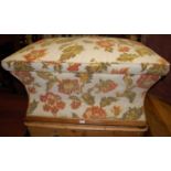 A Victorian mahogany and floral tapestry upholstered hinge topped ottoman, of waisted form and on