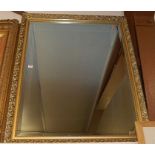 A reproduction gilt framed and bevelled rectangular wall mirror, 112 x 87cm