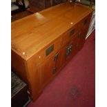 A Chinese elm and brass mounted sideboard, having three upper drawers over twin hinged lower