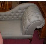 A contemporary buttoned upholstered scroll end chaise longue, raised on cabriole supports, length