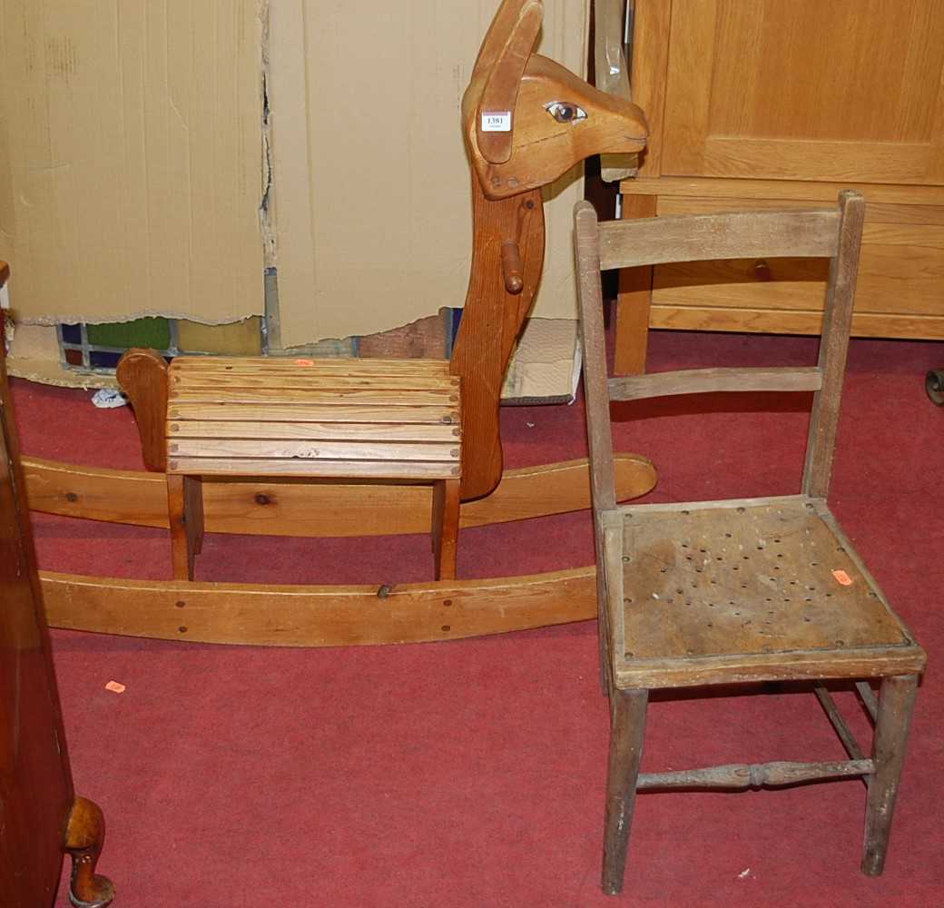 A contemporary pine childs rocking horse; together with a panel seat childs bedroom chair, and a