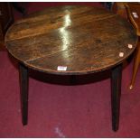 A 19th century provincial oak circular cricket table, dia.60cmCondition report: Height 54cm.