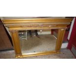 A contemporary gilt decorated bevelled overmantel mirror with floral decoration (some losses),