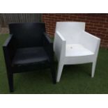 A set of six contemporary black and white press-moulded plastic stacking garden chairs