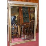 A large contemporary gilt framed and bevelled rectangular wall mirror, 136 x 105cm