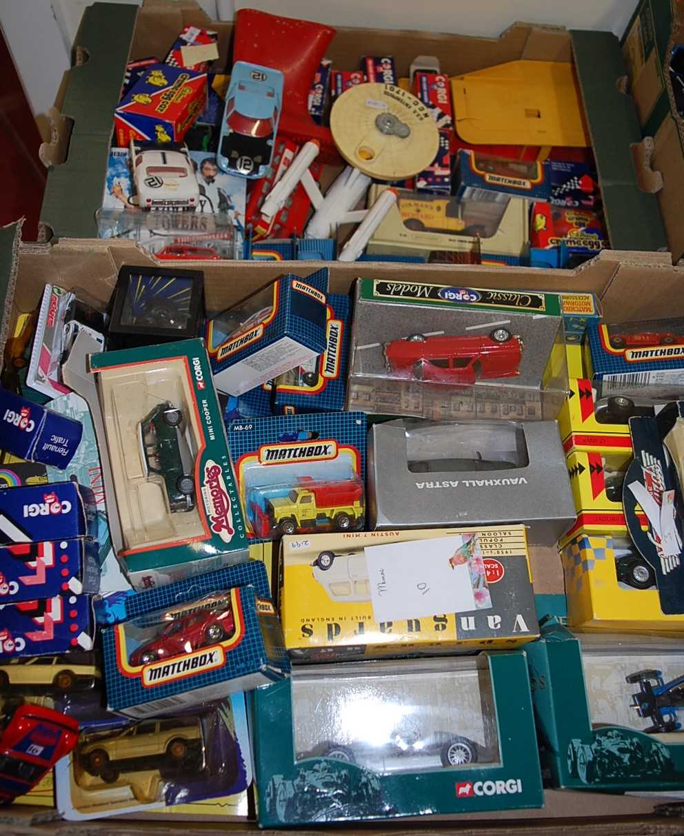 Three boxes of mixed diecast to include boxed Matchbox cars, and Vanguard, Dinky Toys, USS