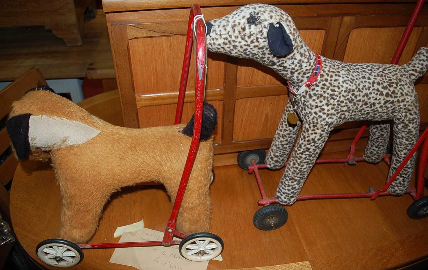 Two childs push-along dogs on wheels