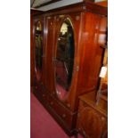 An early 20th century mahogany double mirror door wardrobe having twin short lower drawers, width