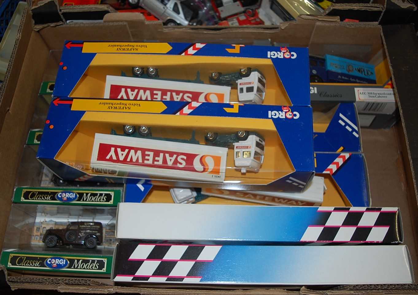 A box of Corgi modern issue diecast to include Safeway wagons, Corgi Classic models, etc