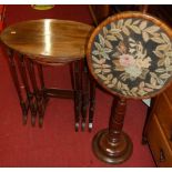 A mahogany nest of three occasional tables, raised on spindle turned supports, the largest w.60cm