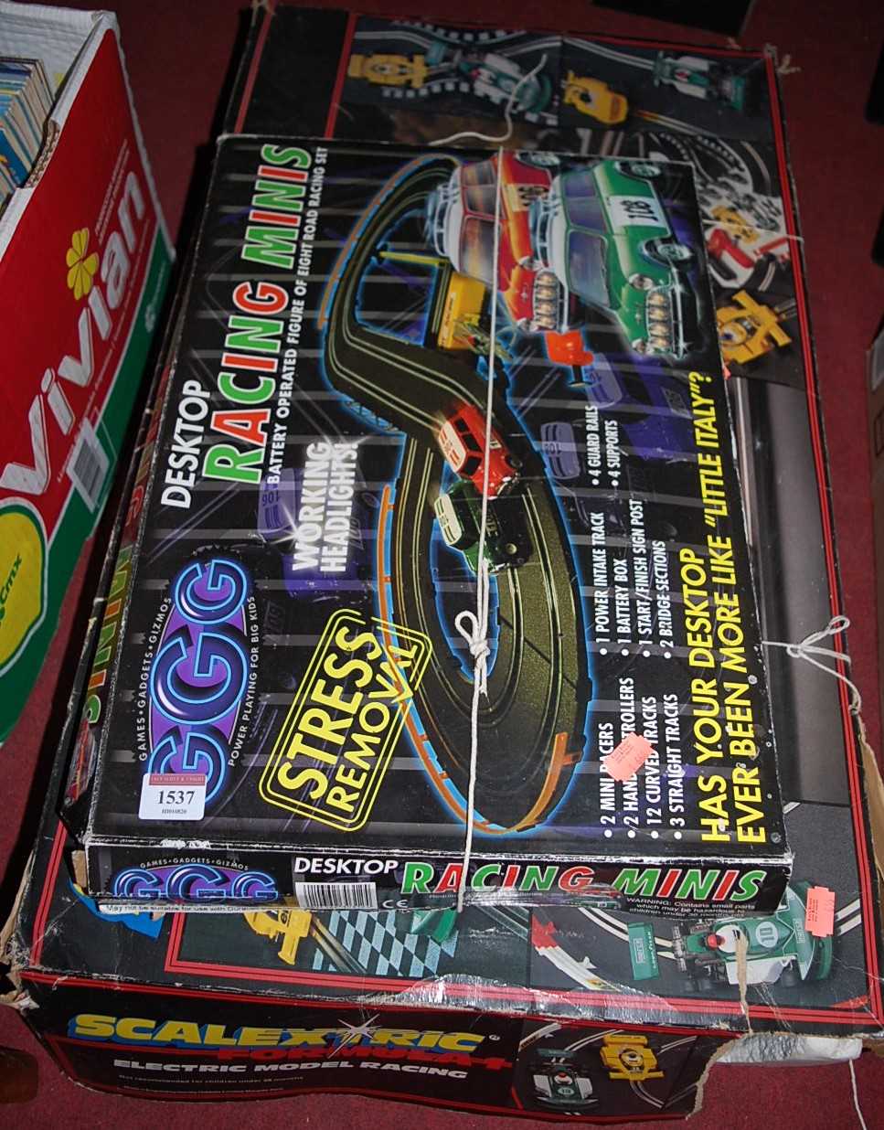 A boxed Scalextric F1 racing set and a desk top Racing Minis box set