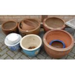 A collection of various stoneware planters, to include a reproduction Chinese example
