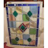 Two lead framed coloured glass inset window panels, the largest 100x67cm