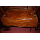 An early 19th century mahogany round cornered Pembroke table, having single end drawer on turned