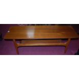 A 1970s teak low coffee table having platform undertier, length 116cm