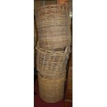 Four sundry circular wicker log baskets, together with a picnic hamper (5)