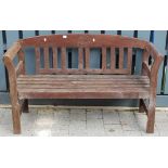 A contemporary stained and slatted teak two-seater garden bench, w.128cm