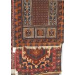 A Persian woollen brown ground rug 130x80cm, together with a further Persian blue ground woollen rug