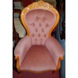 A contemporary beech framed and pink buttonback upholstered showframe armchair, w.69cm