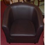 A contemporary chocolate brown leather tub chair