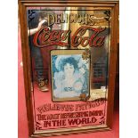 An advertising wall mirror for Coca-Cola, 87 x 55cm, in moulded pine frame
