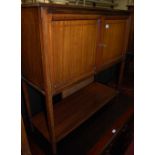 An Edwardian mahogany and chequer strung double door side cupboard, having platform undertier, w.