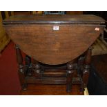 An antique oak low dropflap gateleg occasional table, w.67cm