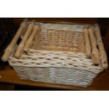 Three contemporary graduated wicker baskets